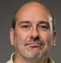 a man wearing a yellow shirt