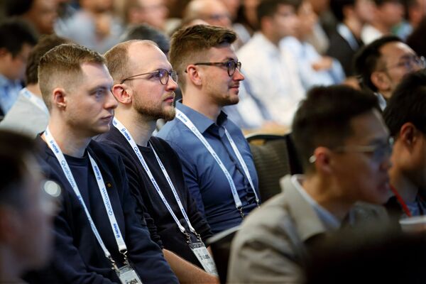 a group of people seated listening to the presentation